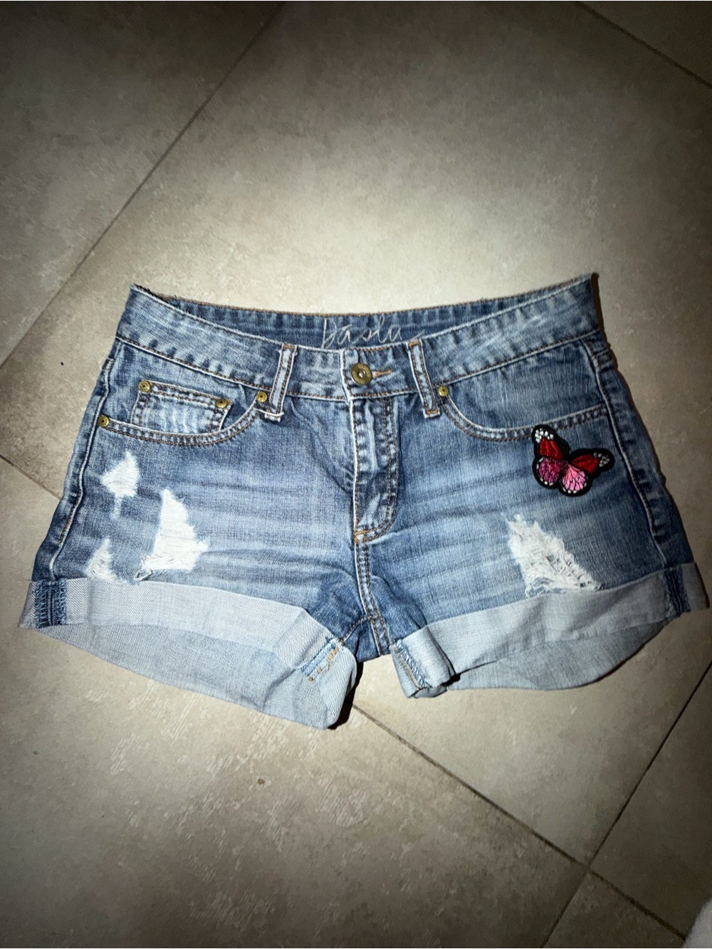 Light Blue Distressed Denim Shorts with Pink Butterfly Patch